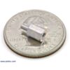 Aluminum standoff 0.25 inch 2-56 M-F with U.S. quarter for size reference. (SKU: POLOLU-1948 Image 2)