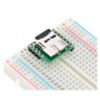 Breakout Board for microSD Card plugged into a breadboard with microSD card (not included) inserted. (SKU: POLOLU-2597 Image 5)