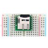 Breakout Board for microSD Card plugged into a breadboard with microSD card (not included) inserted. (SKU: POLOLU-2597 Image 6)
