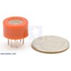 Gas sensor with orange plastic case with quarter for size reference. (SKU: POLOLU-1483 Image 2)