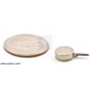Shaftless vibration motor 10x3.4mm with quarter for size reference. (SKU: POLOLU-1636 Image 4)