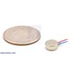 Shaftless vibration motor 8x3.4mm with quarter for size reference. (SKU: POLOLU-1637 Image 4)
