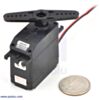 SpringRC SM-S4303R continuous rotation servo with a US quarter for size reference. (SKU: POLOLU-1248 Image 2)