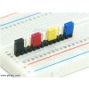 0.100 inch (2.54 mm) shorting blocks of assorted colors on a 0.1 inch header strip. (SKU: POLOLU-970 Image 2)