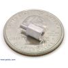 Aluminum standoff 0.25 inch 2-56 M-F with U.S. quarter for size reference. (SKU: POLOLU-1945 Image 2)