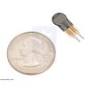 Force-sensing resistor (0.25-diameter circle short tail) with a US quarter for size reference. (SKU: POLOLU-2727 Image 2)
