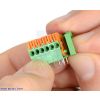 Removing the end cap from a 6-pin side-entry screwless terminal block. (SKU: POLOLU-2420 Image 3)