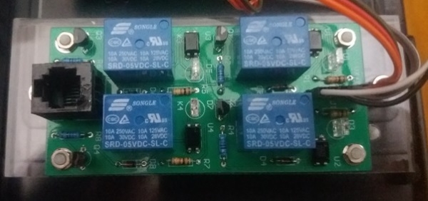 Top down photo of the Modbus Controller's accompanying Relay Board, using 4 different relays with a RJ connector visible