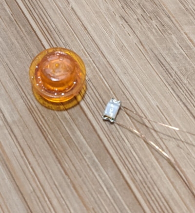 SMD LED and stud A tiny SMD LED next to a 1x1 trans stud