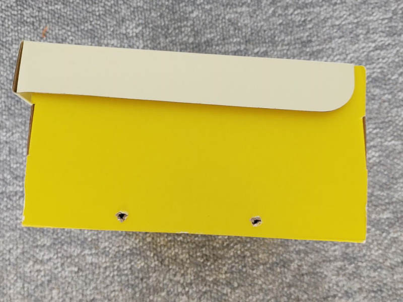 Two holes on the back for wires Making two holes for the motor wires on the back of the box