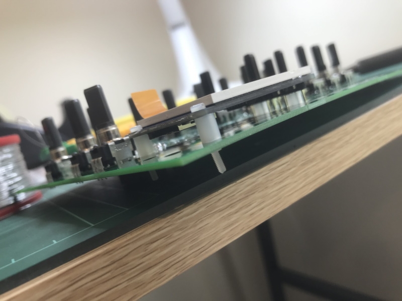 The LCD soldered onto the upper board with spacers between the two